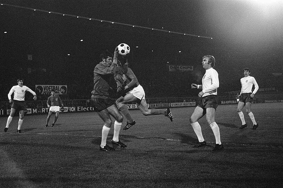 Bobby Moore standing with goalkeeper Peter Bonetti during an England match