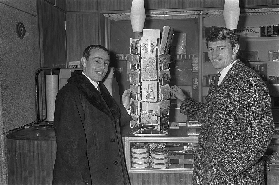 Two Liverpool players buying postcards in a hotel in 1966