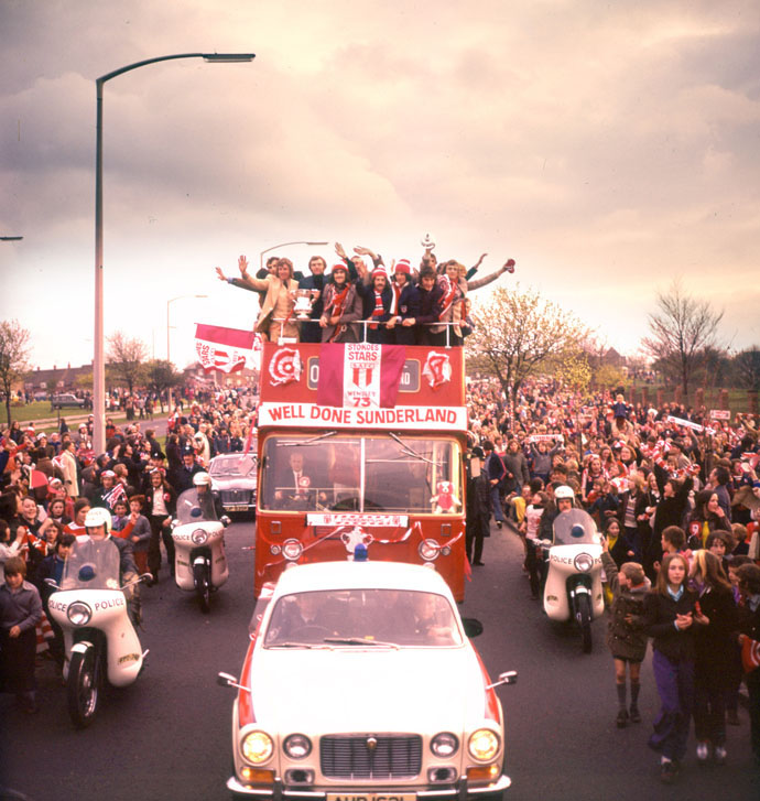 Fans line the streets as the Sunderland team return home with the FA Cup