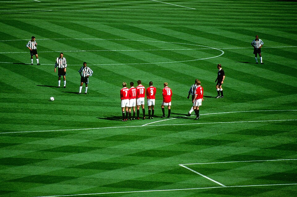 Nolberto Solano preparing to take a free kick on the edge of the Manchester United penalty area