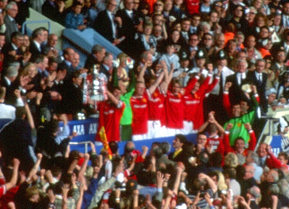 Roy Keane lifting the FA Cup after receiving it from the Prince of Wales