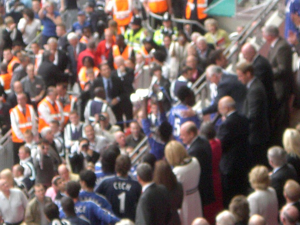 Chelsea players collecting the FA Cup trophy from Prince William at Wembley
