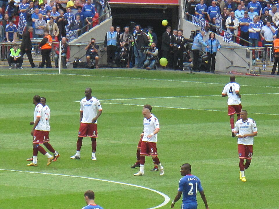 Portsmouth players gathered in the centre circle before kick-off at Wembley