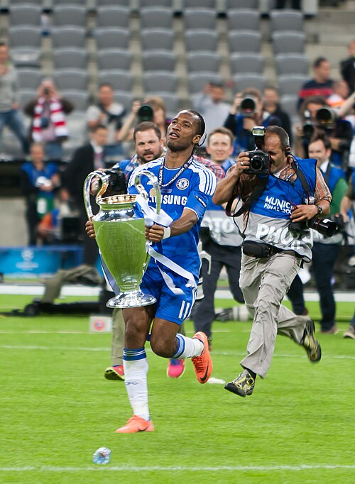 Didier Drogba holding the European Cup trophy