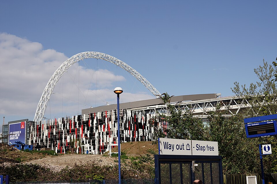 Wembley Stadium seen from a distance, with the arch visible above the stands
