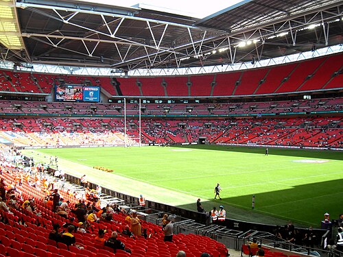 The exterior of Wembley Stadium with its arch above the concourse